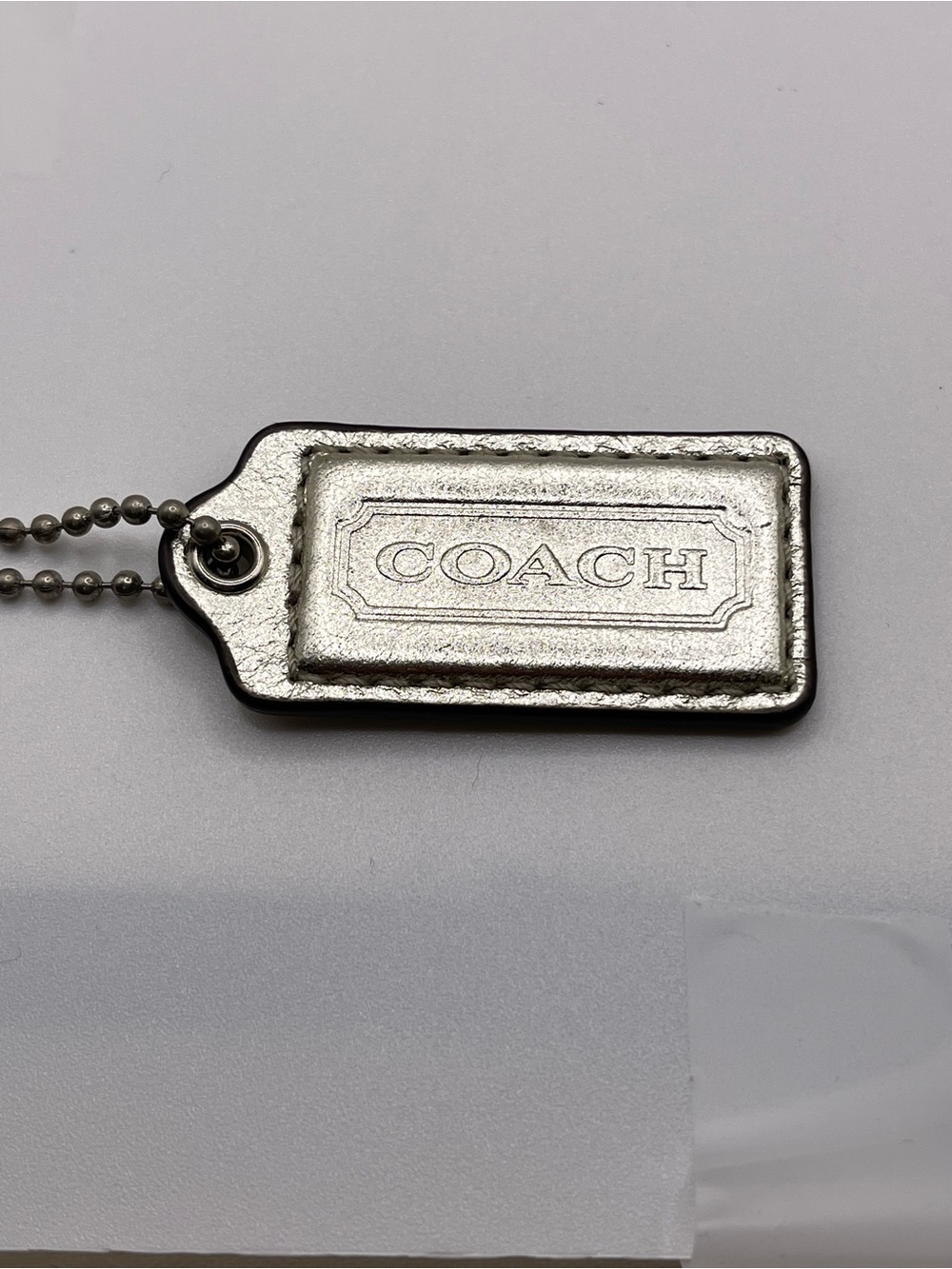 Coach Silver Metallic Leather Hang Tag